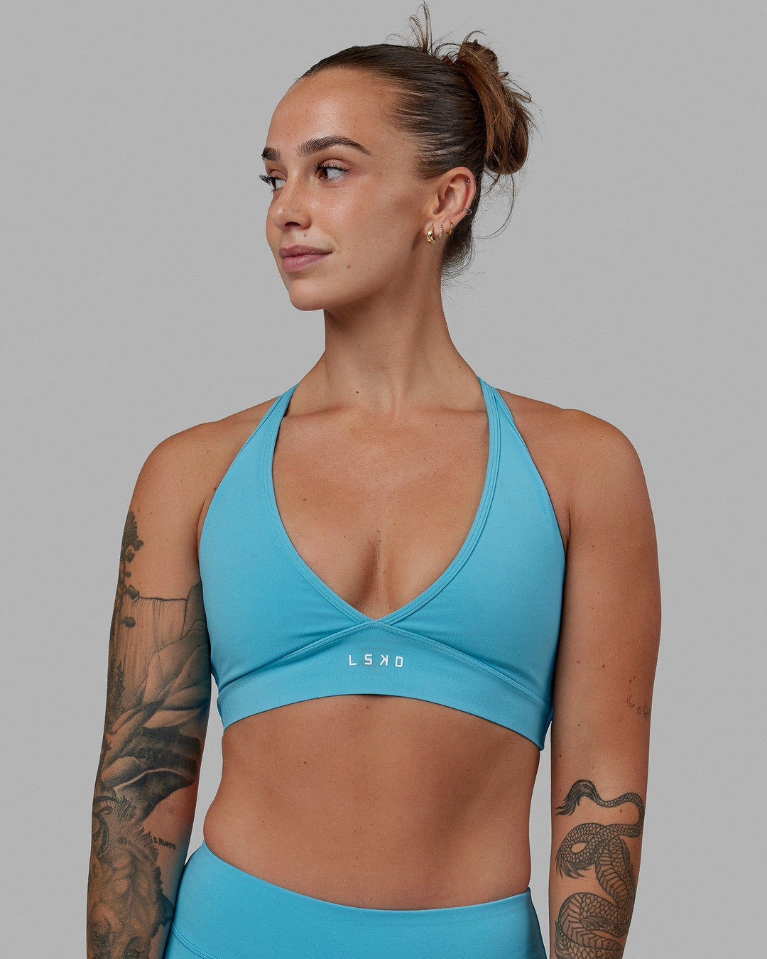 Woman wearing Form Sports Bra - Pacific Blue
