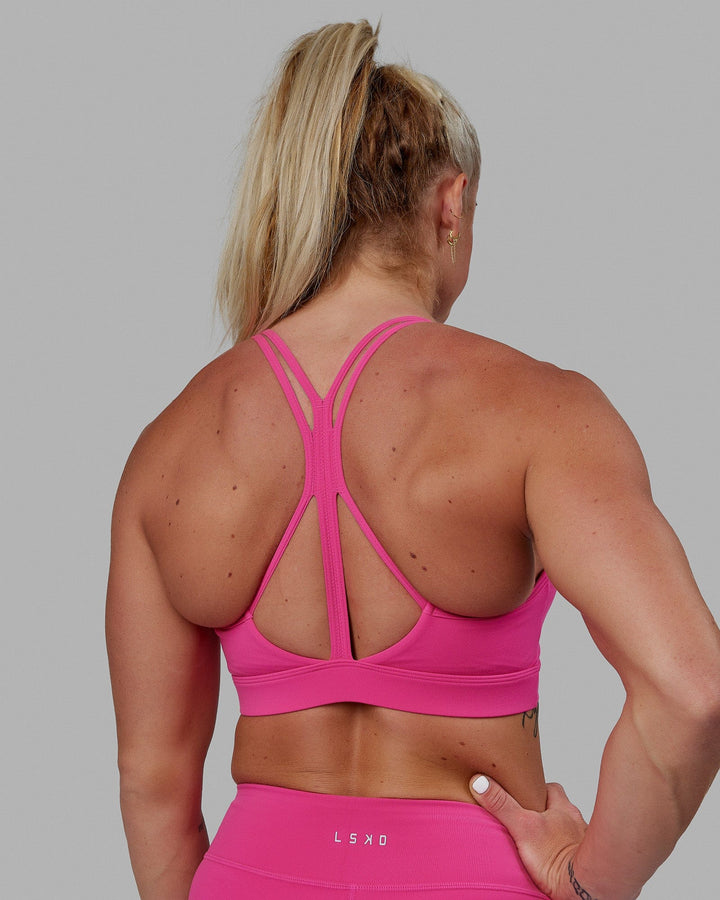 Woman wearing Form Sports Bra - Ultra Pink