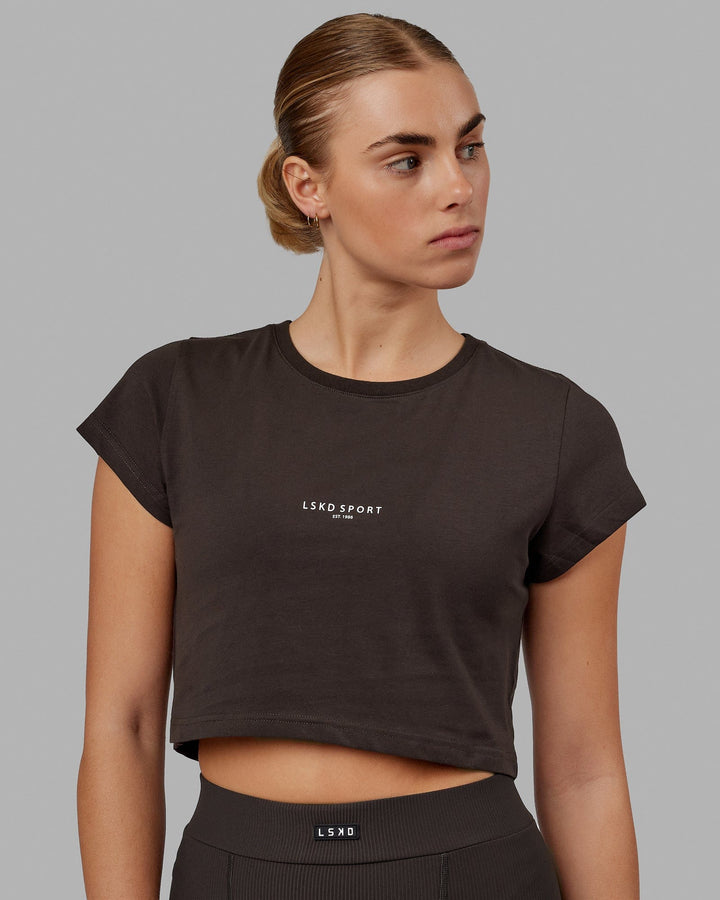 Woman wearing Front Runner Baby Tee - Dark Walnut
