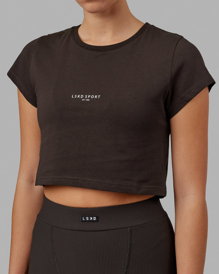 Woman wearing Front Runner Baby Tee - Dark Walnut