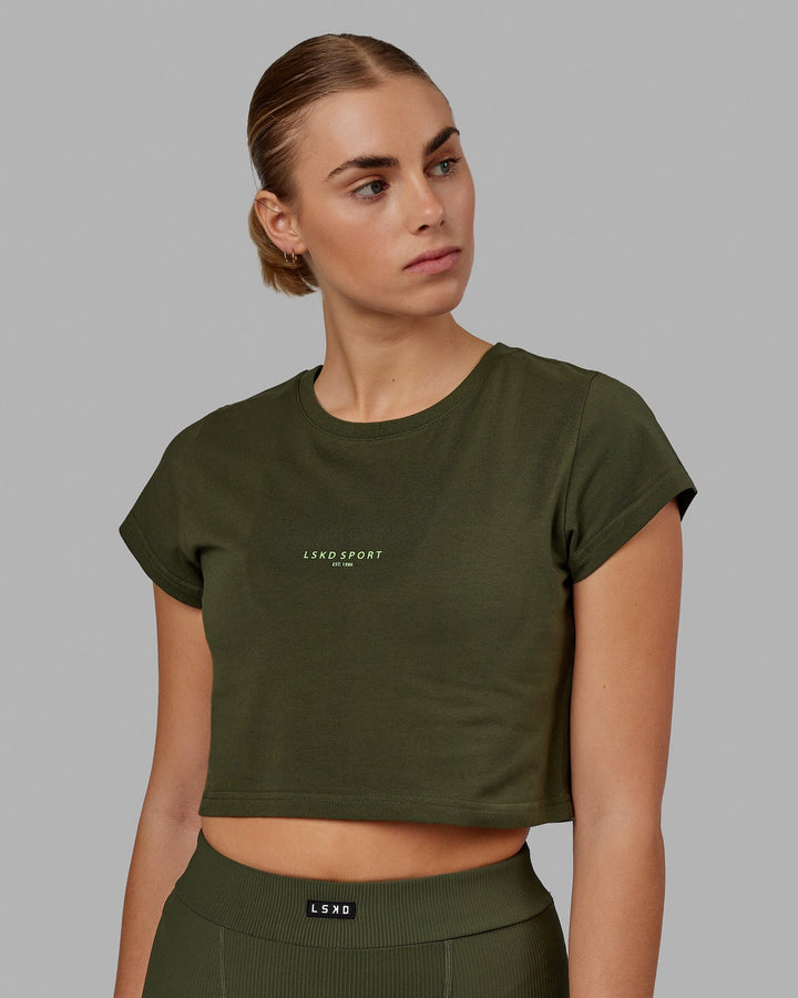 Woman wearing Front Runner Baby Tee - Forest Night