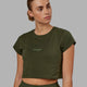 Woman wearing Front Runner Baby Tee - Forest Night