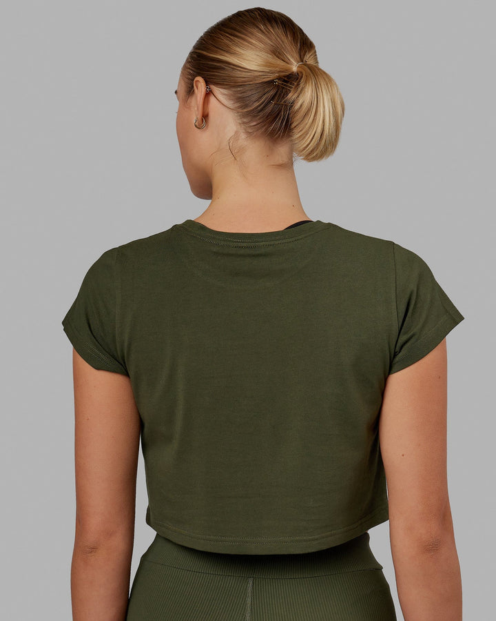 Woman wearing Front Runner Baby Tee - Forest Night