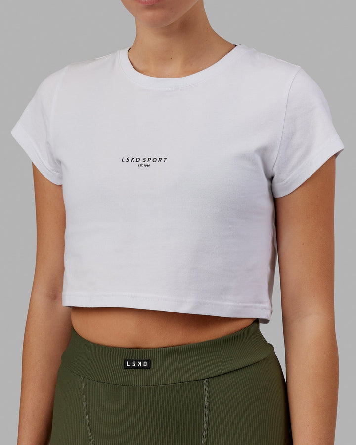 Woman wearing Front Runner Baby Tee - White