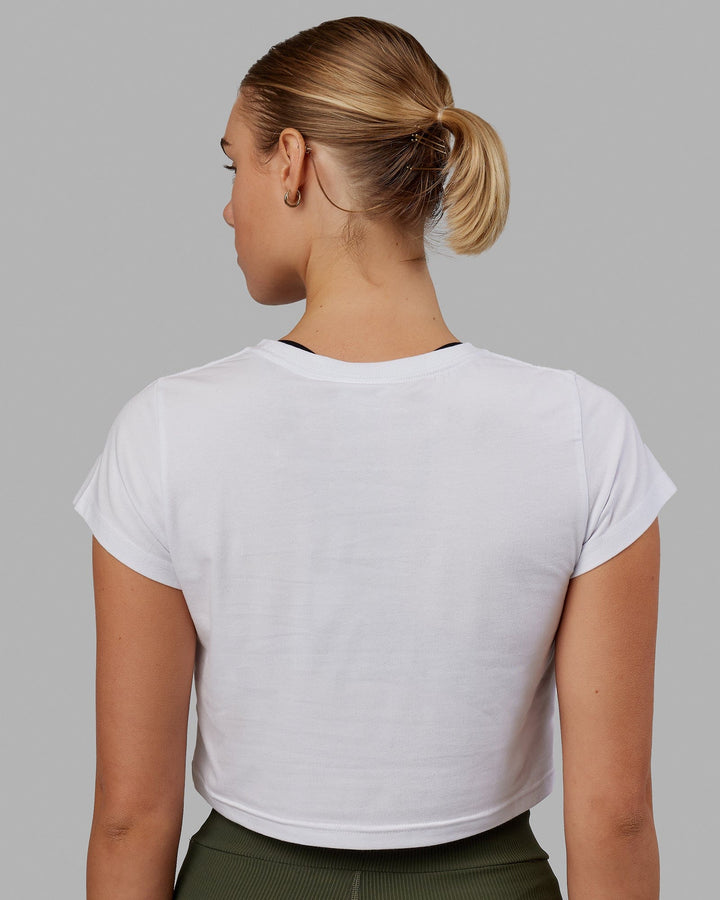 Woman wearing Front Runner Baby Tee - White