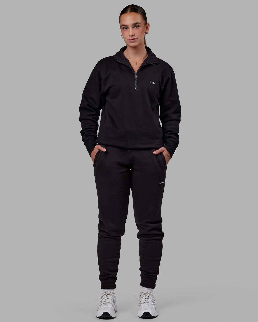 Woman wearing Unisex Fundamental 1/4 Zip Sweater - Black