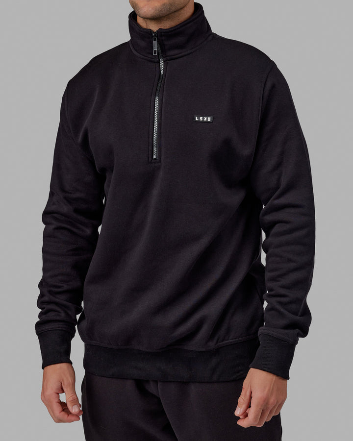 Man wearing Unisex Fundamental 1/4 Zip Sweater - Black