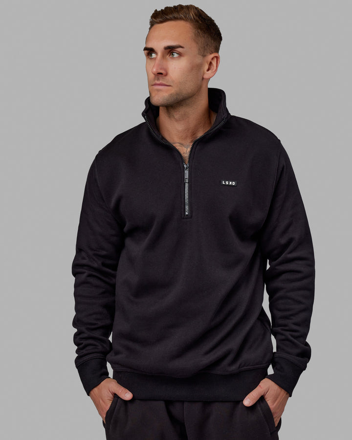 Man wearing Unisex Fundamental 1/4 Zip Sweater - Black