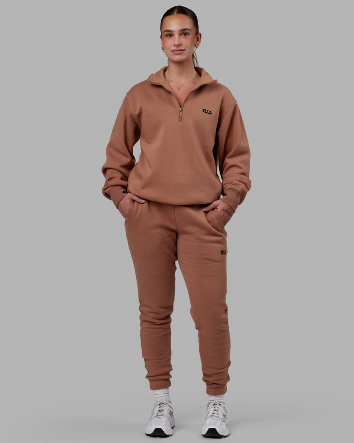 Woman wearing Unisex Fundamental 1/4 Zip Sweater - Raw Umber