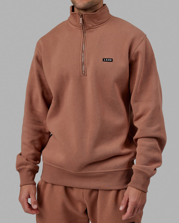 Man wearing Unisex Fundamental 1/4 Zip Sweater - Raw Umber