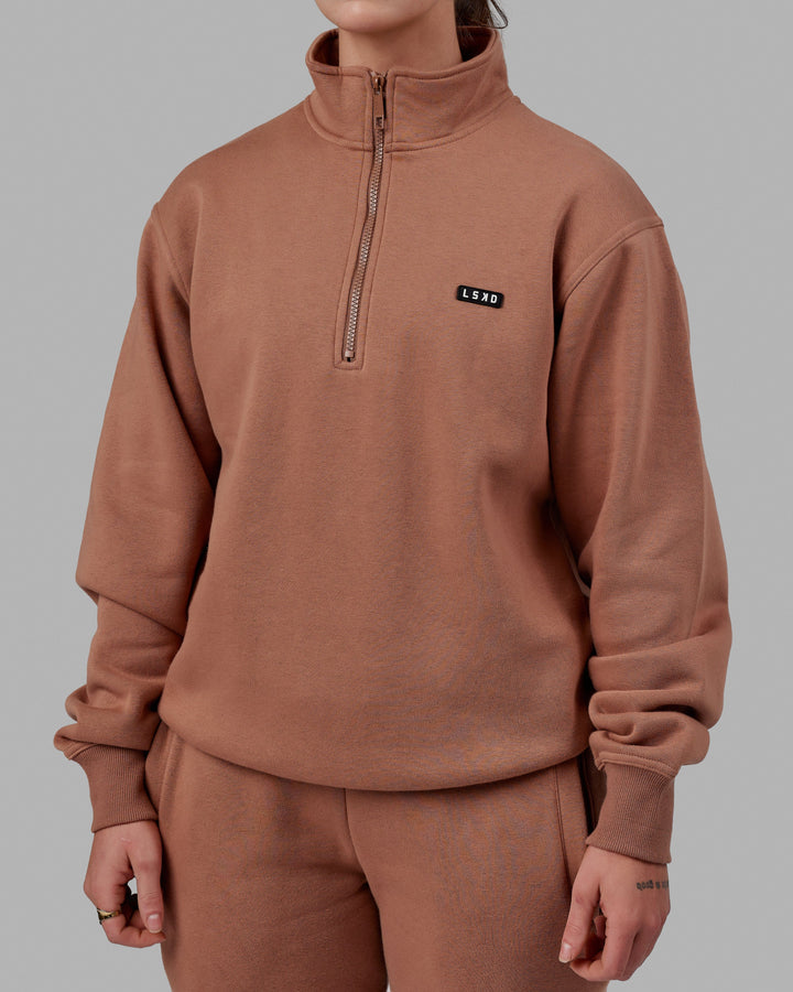 Woman wearing Unisex Fundamental 1/4 Zip Sweater - Raw Umber