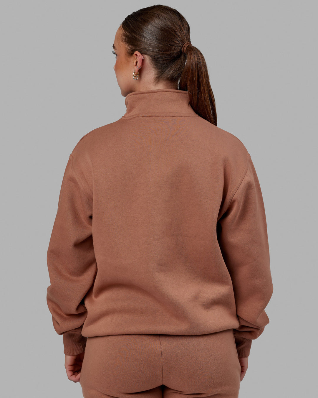 Woman wearing Unisex Fundamental 1/4 Zip Sweater - Raw Umber