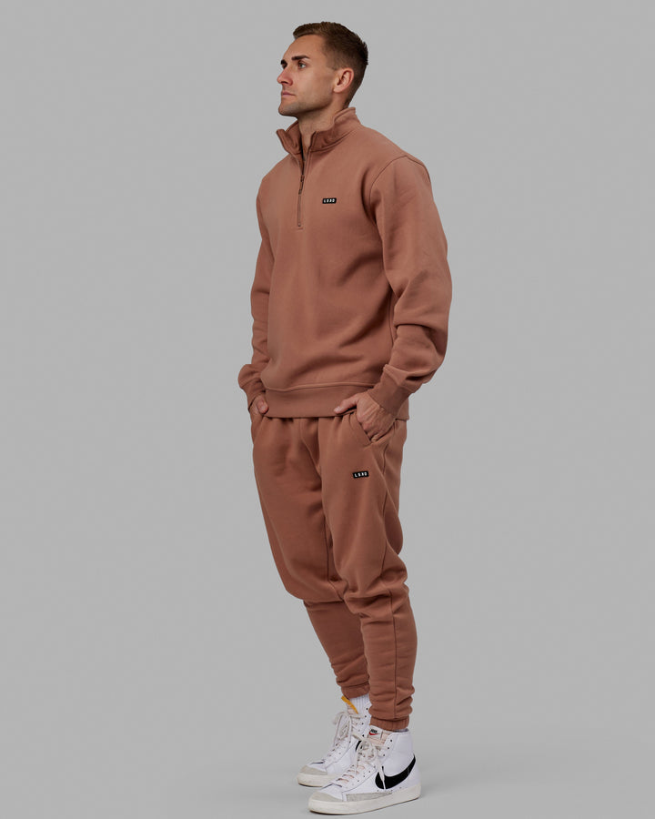 Man wearing Unisex Fundamental 1/4 Zip Sweater - Raw Umber