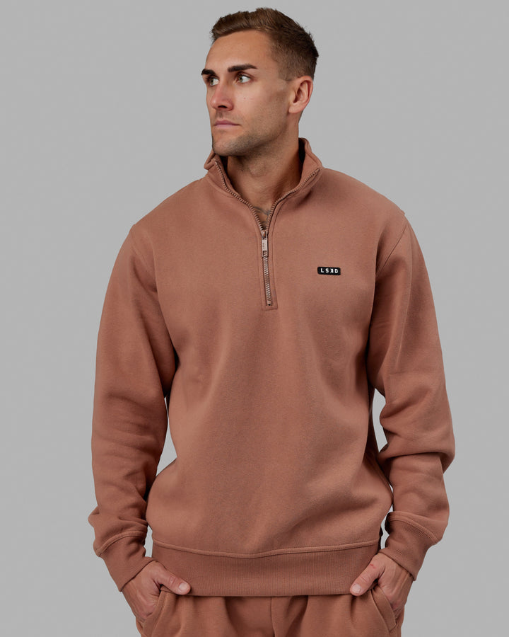 Man wearing Unisex Fundamental 1/4 Zip Sweater - Raw Umber