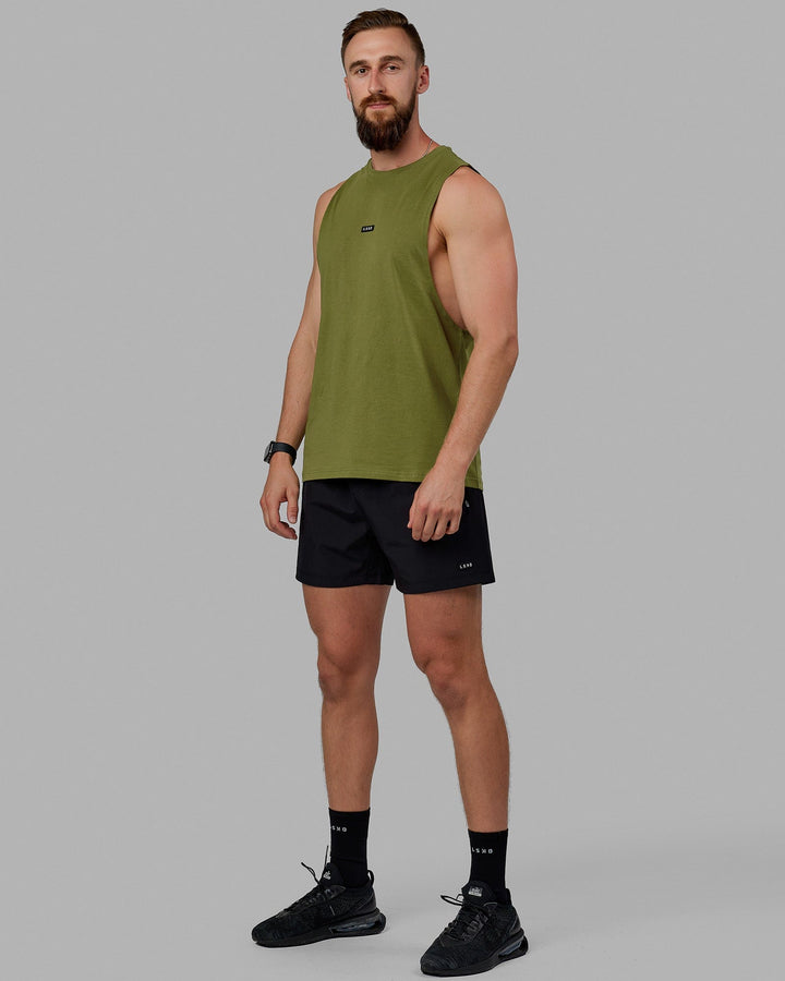 Man wearing Fundamental FLXCotton Drop Arm Tank - Moss