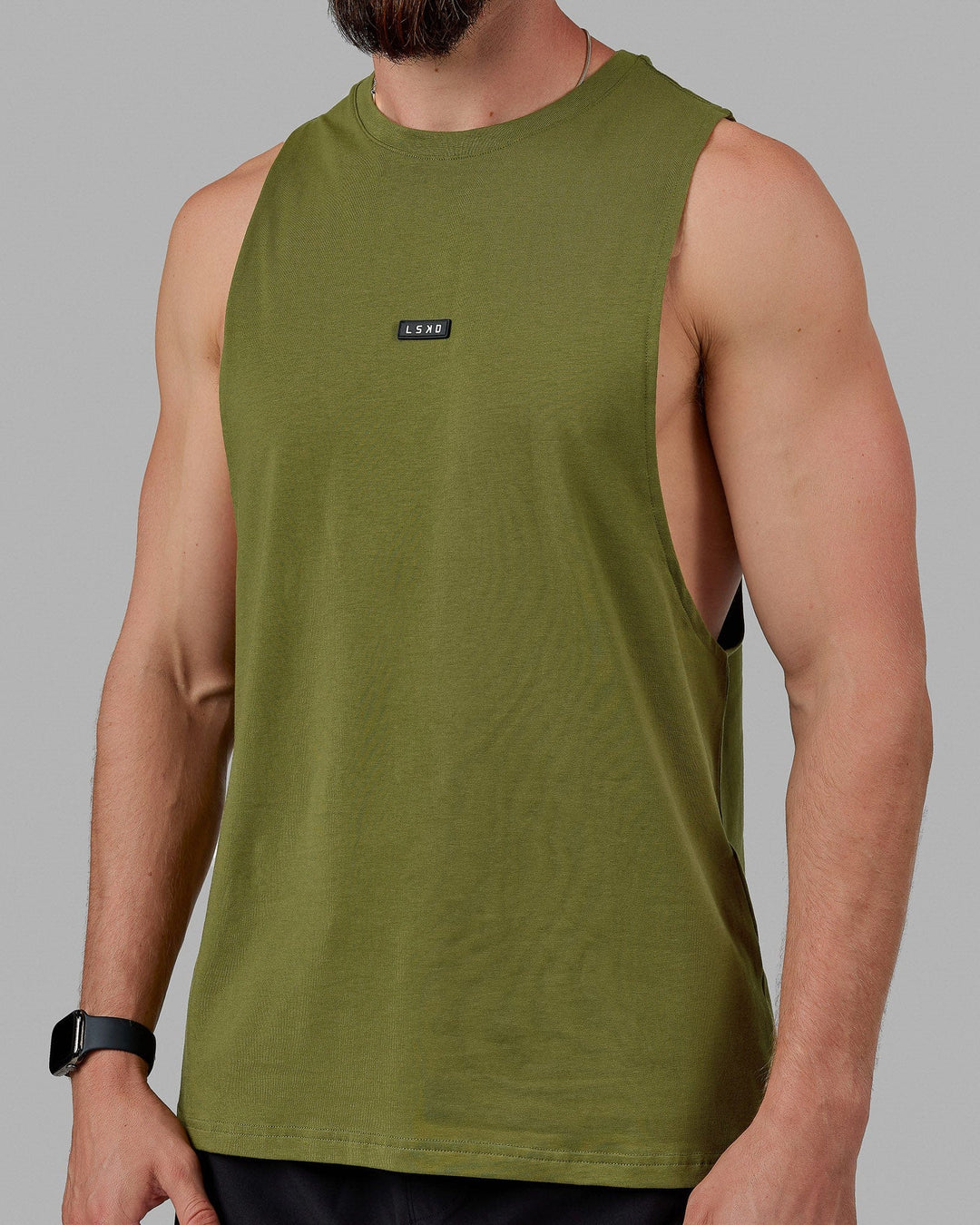 Man wearing Fundamental FLXCotton Drop Arm Tank - Moss