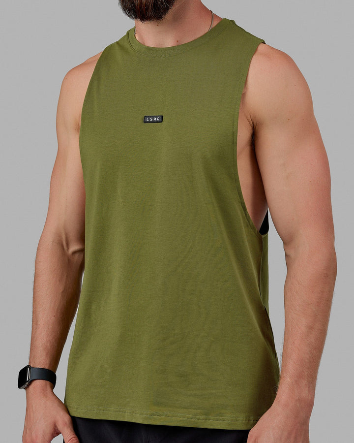 Man wearing Fundamental FLXCotton Drop Arm Tank - Moss