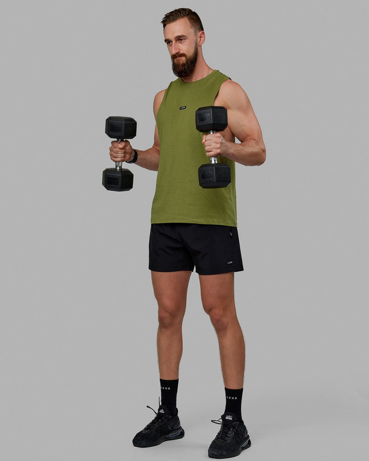 Man wearing Fundamental FLXCotton Drop Arm Tank - Moss