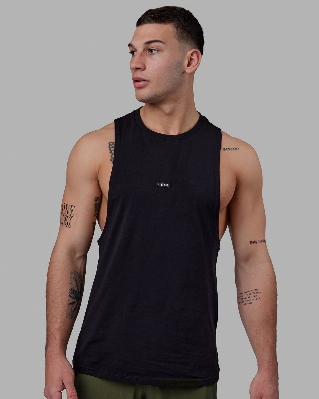 Man wearing Fundamental FLXCotton Drop Arm Tank - Black