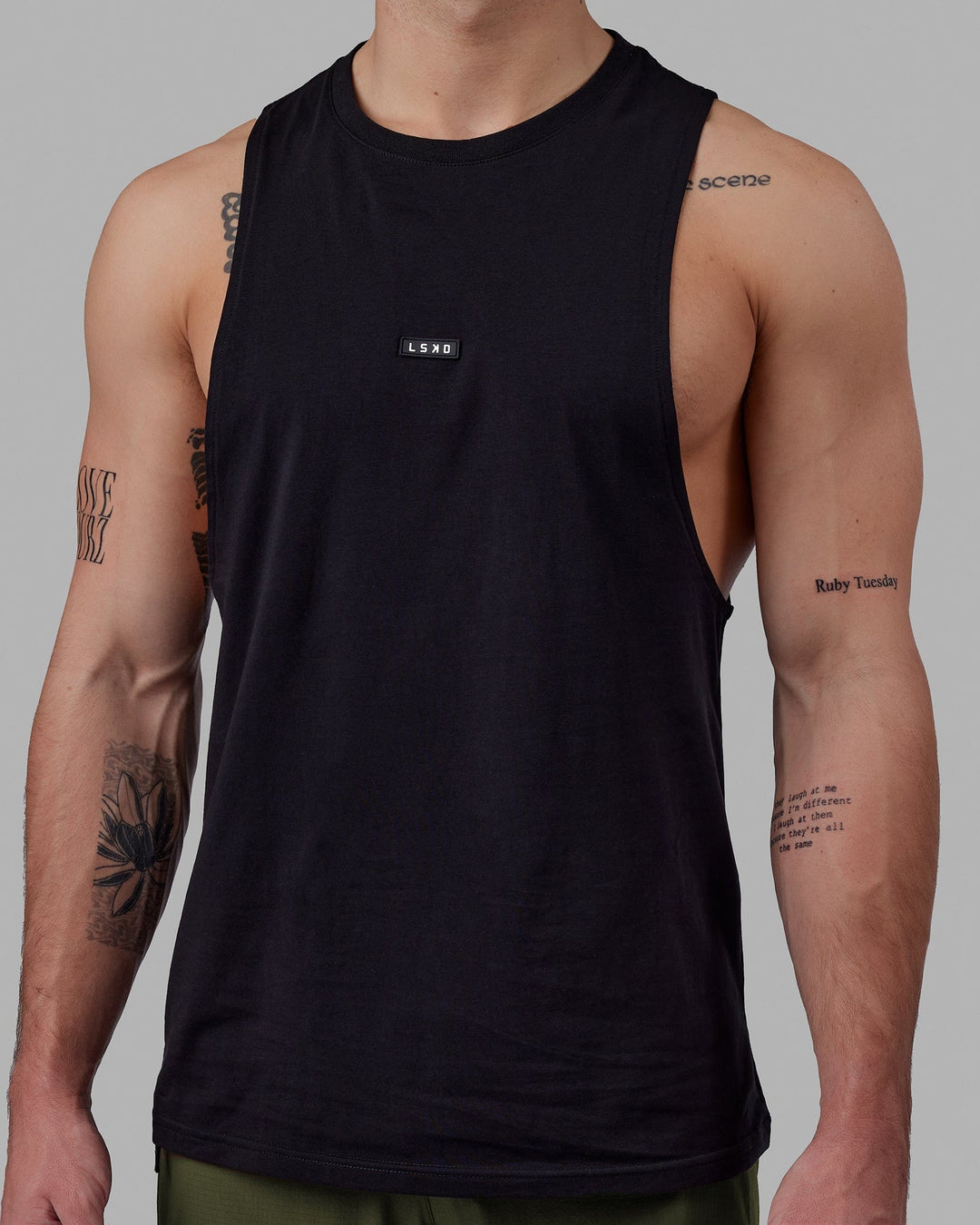 Man wearing Fundamental FLXCotton Drop Arm Tank - Black