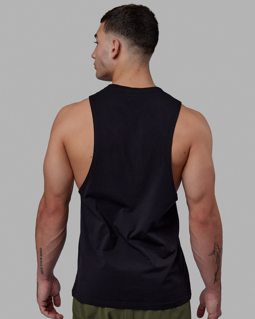 Man wearing Fundamental FLXCotton Drop Arm Tank - Black