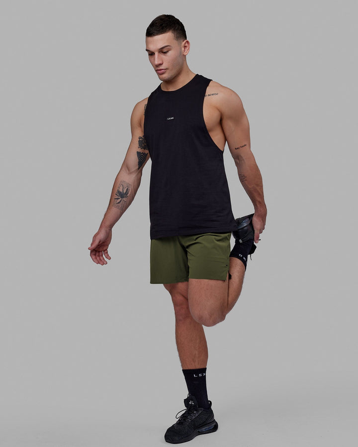 Man wearing Fundamental FLXCotton Drop Arm Tank - Black