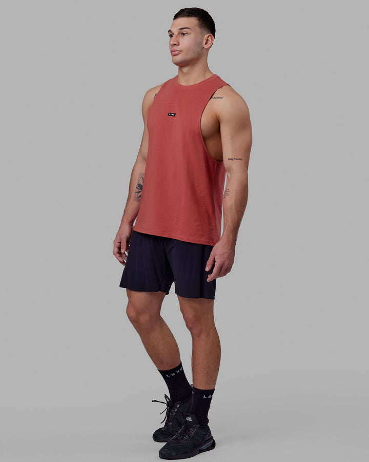 Man wearing Fundamental FLXCotton Drop Arm Tank - Mineral Red