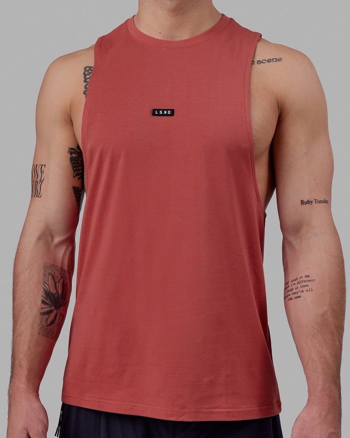 Man wearing Fundamental FLXCotton Drop Arm Tank - Mineral Red