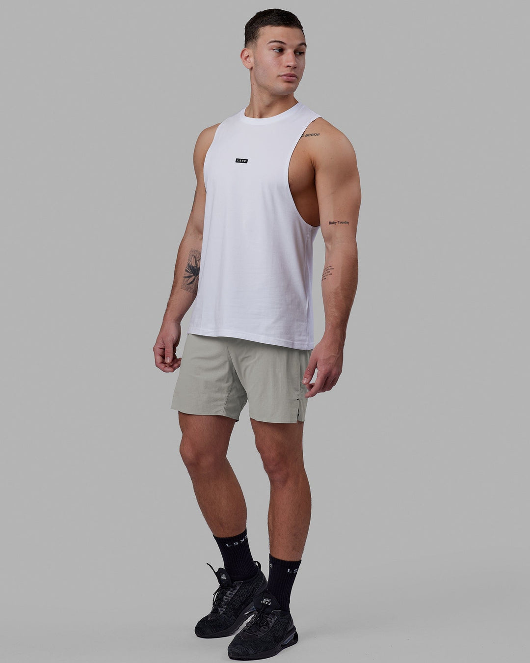 Man wearing Fundamental FLXCotton Drop Arm Tank - White