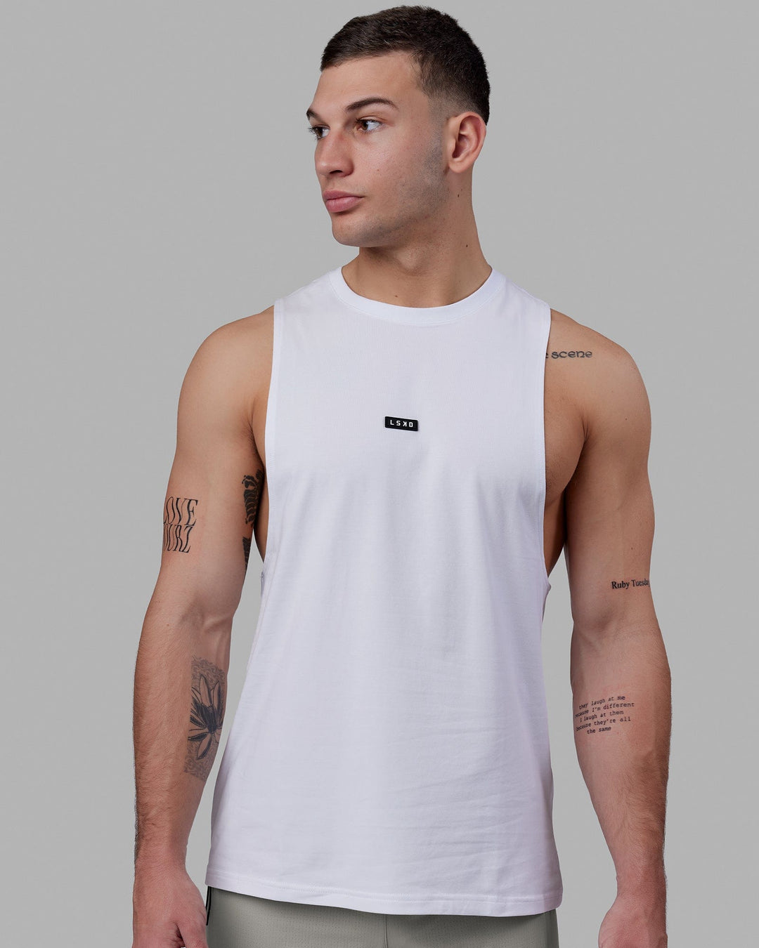 Man wearing Fundamental FLXCotton Drop Arm Tank - White