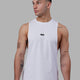 Man wearing Fundamental FLXCotton Drop Arm Tank - White