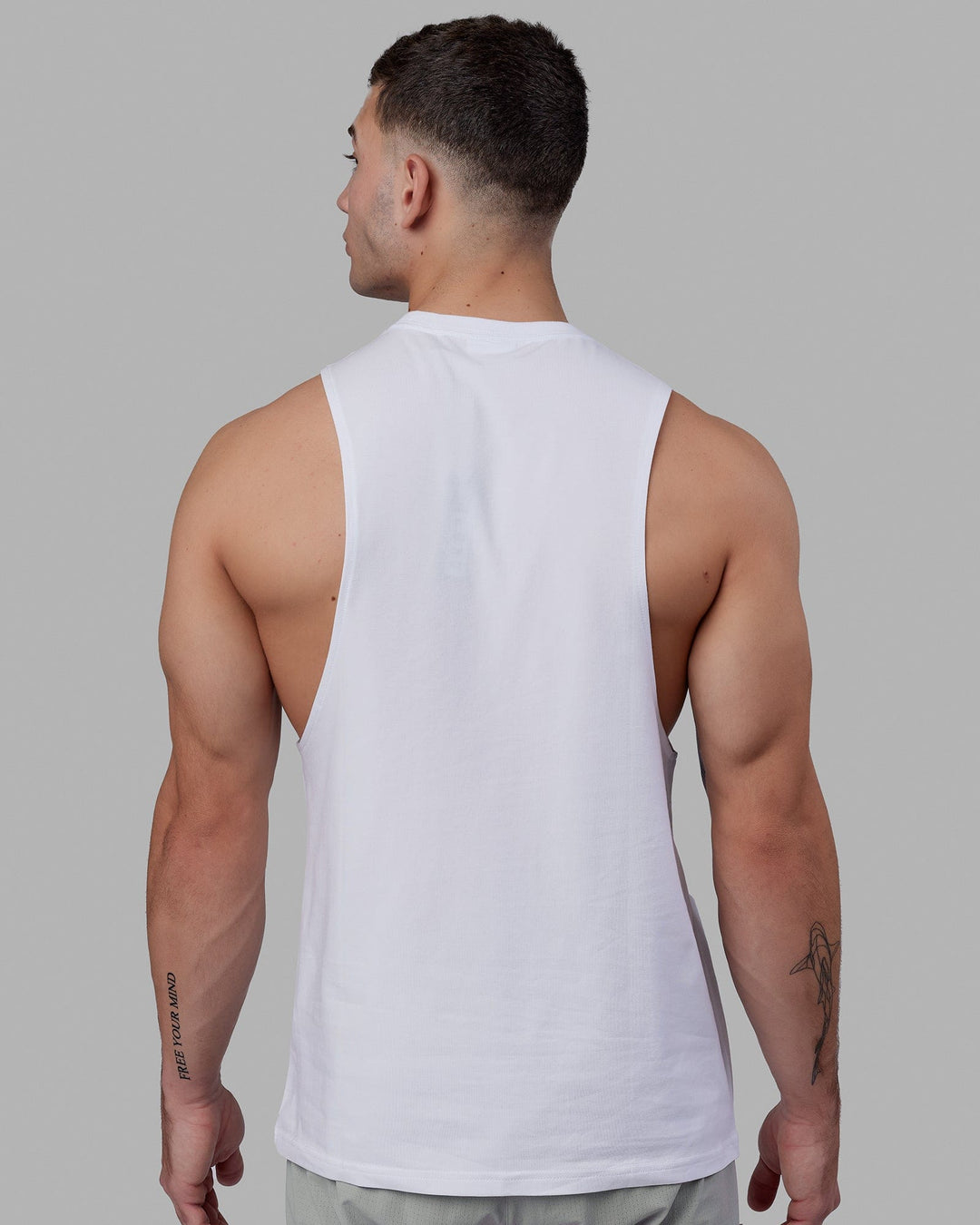 Man wearing Fundamental FLXCotton Drop Arm Tank - White