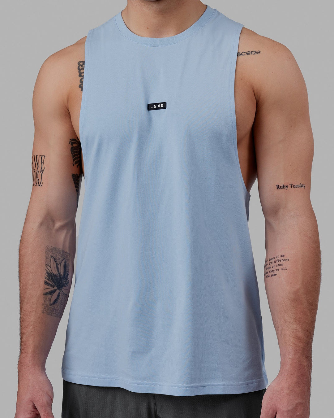 Man wearing Fundamental FLXCotton Drop Arm Tank - Windsurfer