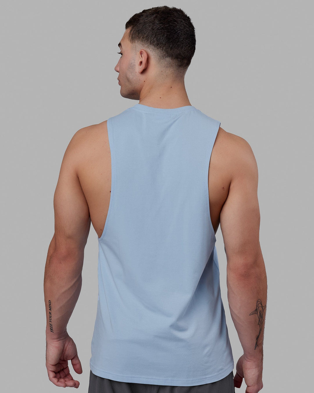 Man wearing Fundamental FLXCotton Drop Arm Tank - Windsurfer