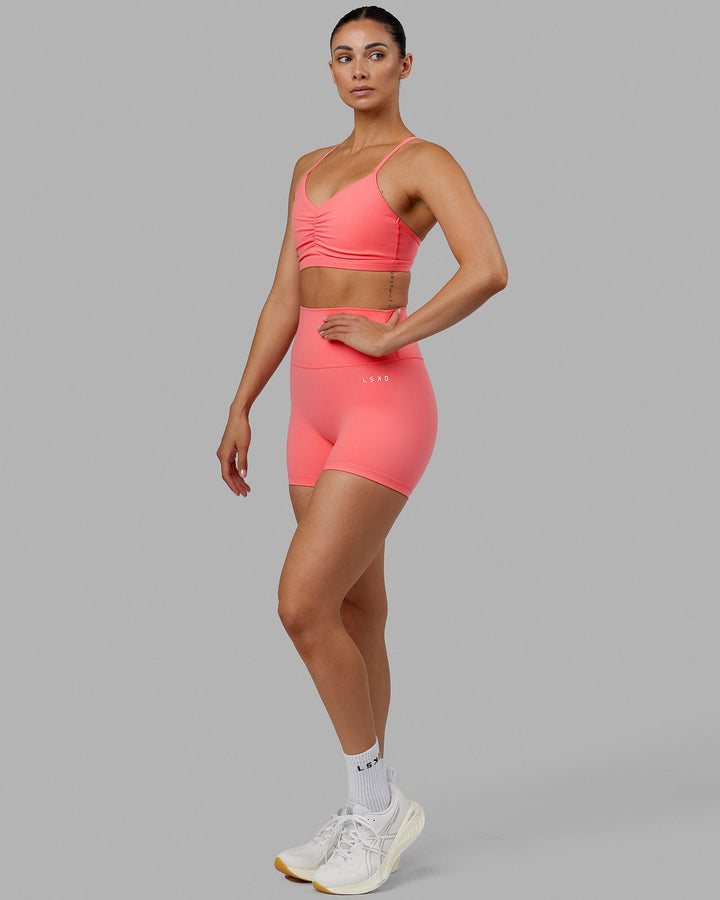 Woman wearing Fundamental Sports Bra - Coral