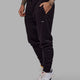Man wearing Unisex Fundamental Track Pant - Black
