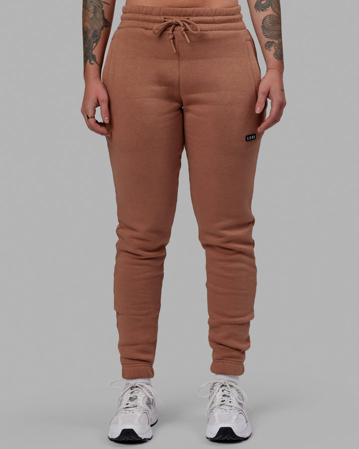 Woman wearing Unisex Fundamental Track Pant - Raw Umber