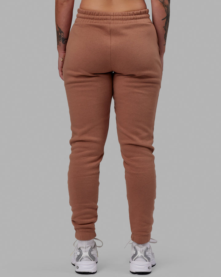 Woman wearing Unisex Fundamental Track Pant - Raw Umber