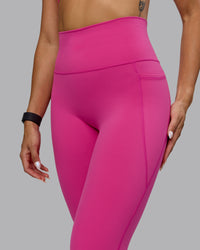 Woman wearing Fusion Ultra High-Rise 3/4 Legging Pockets - Fuchsia Pink | Model:Vanessa | Size:S