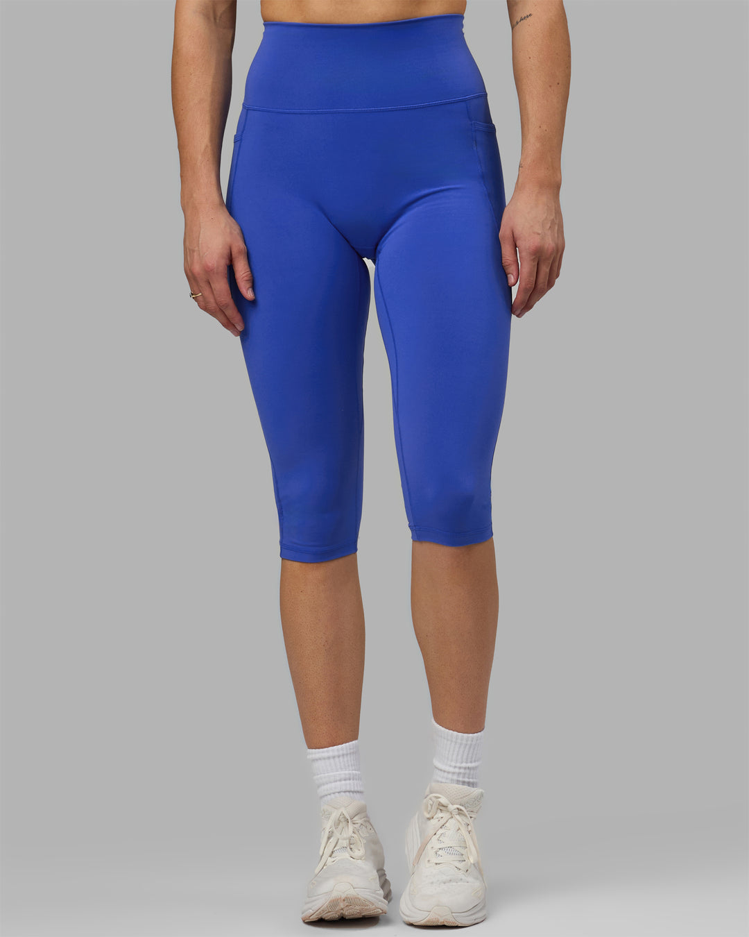 Woman wearing Fusion Ultra High-Rise 3/4 Legging Pockets - Power Cobalt | Model:Hannah | Size:S