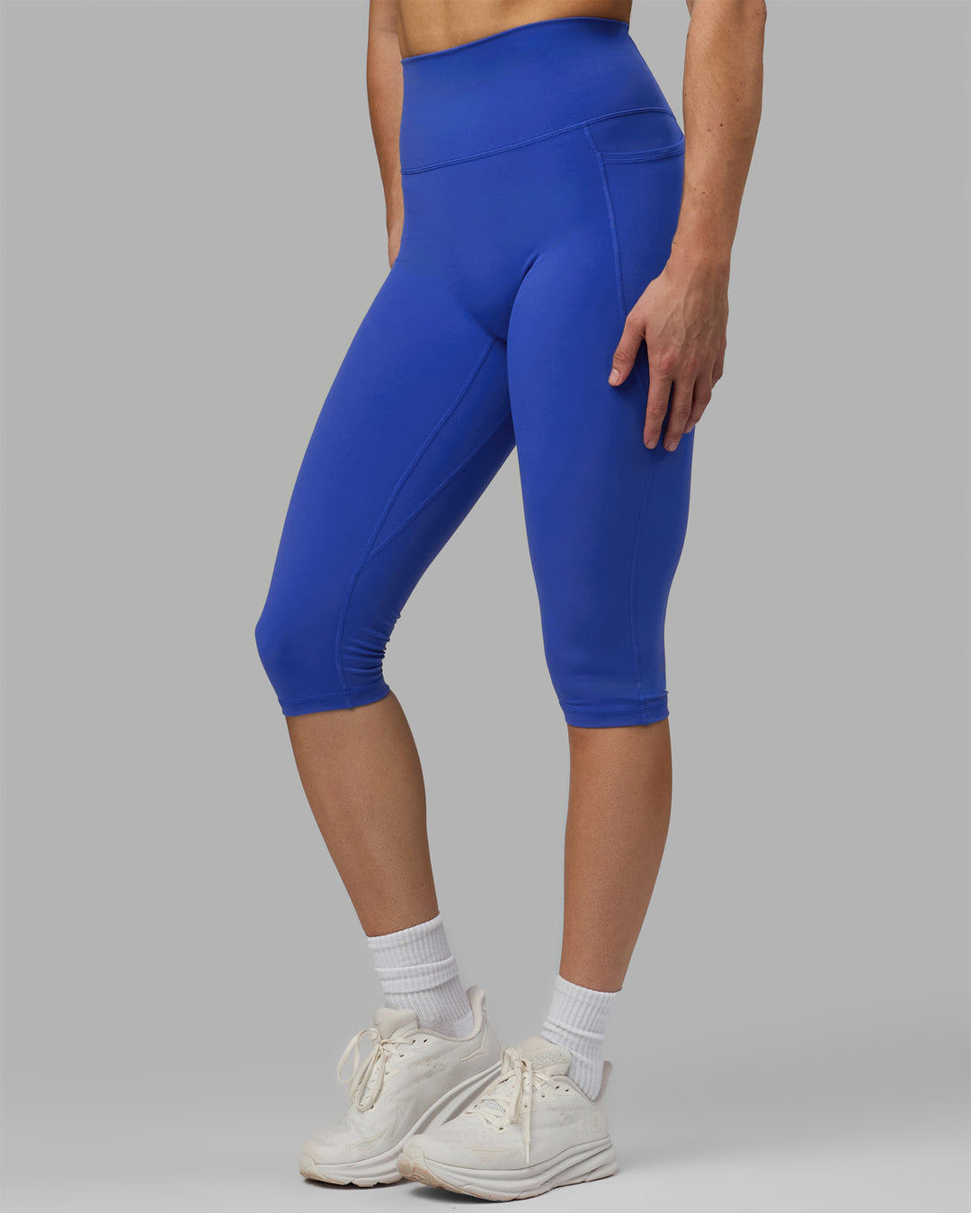 Woman wearing Fusion Ultra High-Rise 3/4 Legging Pockets - Power Cobalt | Model:Hannah | Size:S
