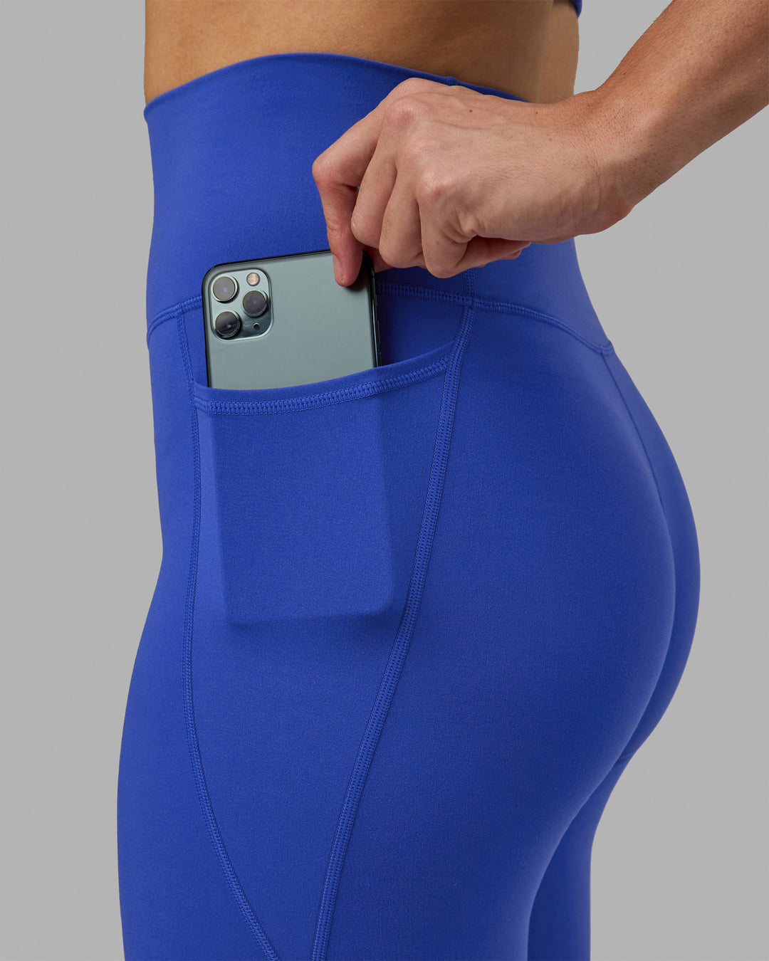 Woman wearing Fusion Ultra High-Rise 3/4 Legging Pockets - Power Cobalt | Model:Hannah | Size:S