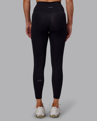 Woman wearing Fusion Ultra High-Rise 7/8 Legging - Black | Model:Hannah | Size:S