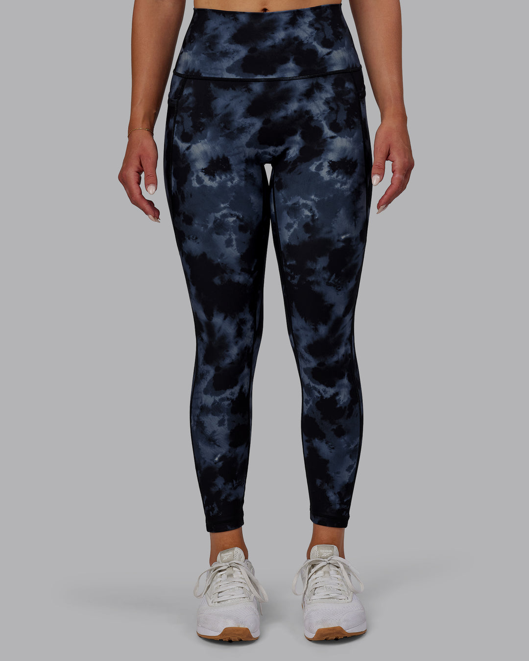 Woman wearing Fusion Ultra High-Rise 7/8 Legging Pockets - Tie Dye-Midnight | Model:Halle | Size:S