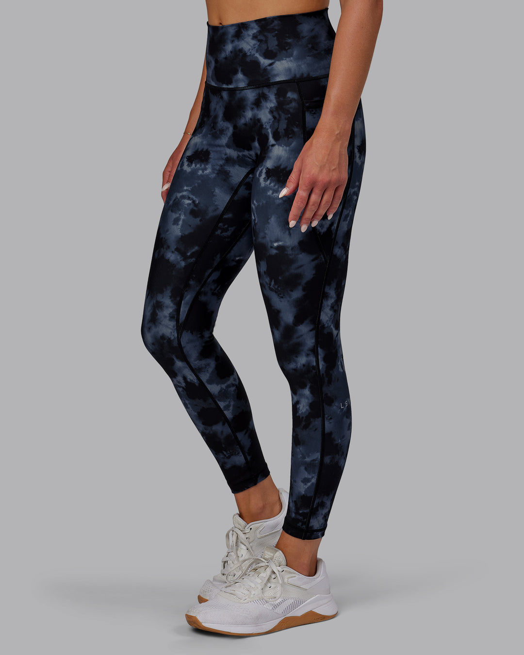 Woman wearing Fusion Ultra High-Rise 7/8 Legging Pockets - Tie Dye-Midnight | Model:Halle | Size:S