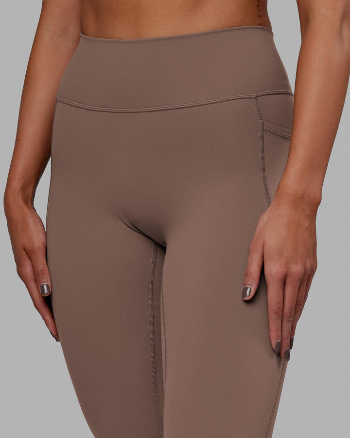 Woman wearing Fusion 7/8 Length Tight - Deep Taupe