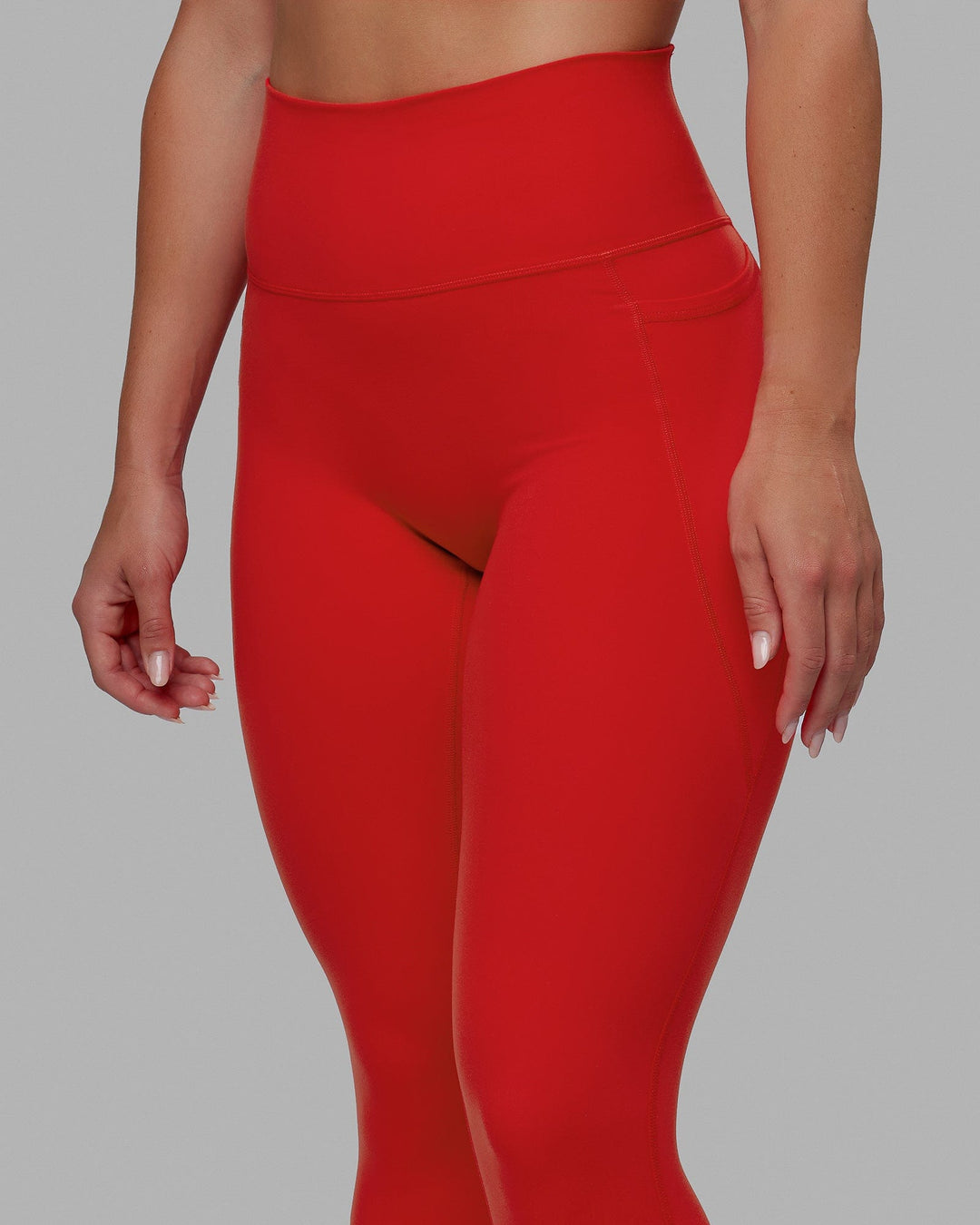 Woman wearing Fusion 7/8 Length Tights - Infrared