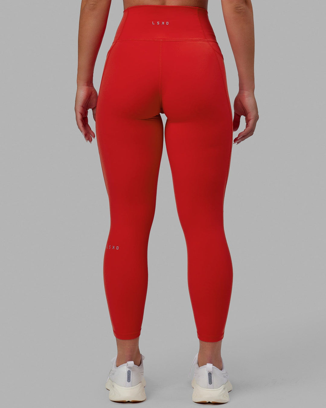 Woman wearing Fusion 7/8 Length Tights - Infrared