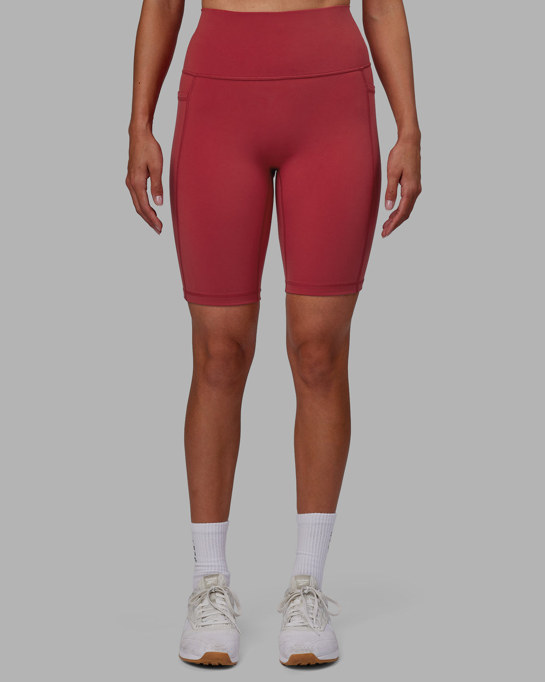 Woman wearing Fusion Ultra High-Rise 9" Short Pockets - Claret | Model:Blaize | Size:S