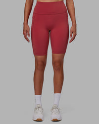 Woman wearing Fusion Ultra High-Rise 9" Short Pockets - Claret | Model:Blaize | Size:S
